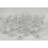 A set of thirteen Edinburgh crystal hock/ white wine glasses with slice cut decoration raised on