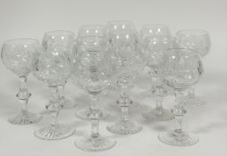A set of thirteen Edinburgh crystal hock/ white wine glasses with slice cut decoration raised on