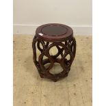 A Chinese style stained hardwood vase stand, pierce carved and of compressed cylindrical form H46cm