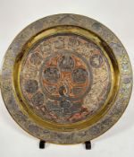 An Middle Eastern brass, white metal and copper inlaid circular plaque with Hebrew figures