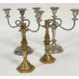 A pair of plated three branch candelabra on circular cast bases (29cm x 33cm x 12.5cm) and a pair of