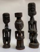 Two carved wooden fertility figures, probably Yombe, Congo, together with a carved figure of a