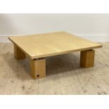 Ligne Roset, A birds eye maple veneered coffee table, the square top raised on block supports,