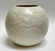 A large monochrome Wedgwood pottery globular vase with raised decoration of scrolling leaves,