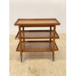 Peter Hvidt, A Danish mid century teak metamorphic three height drinks trolley, the sliding top