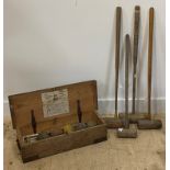 A part croquet set by F.H.Myers Ltd. early 20th century, comprising a set of four various mallets,