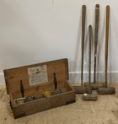 A part croquet set by F.H.Myers Ltd. early 20th century, comprising a set of four various mallets,