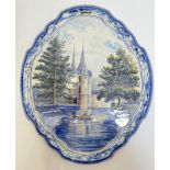 A nineteenth century tin-glazed Dutch Delft Makkum pottery wall-plaque decorated in polychrome