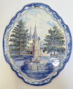 A nineteenth century tin-glazed Dutch Delft Makkum pottery wall-plaque decorated in polychrome