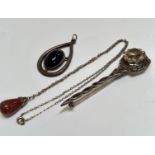 A Scottish Iona style silver brooch set faceted pale citrine with Celtic knot bar (13cm), a
