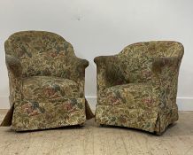 A near pair of early 20th century upholstered tub chairs, moving on casters H87cm