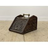 A late 19th century carved oak coal box, with brass carry handle, complete with original scoop