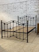 A Victorian style metal 5' king size bed, the frame with brass ball finials. H130cm, L218cm, W155cm