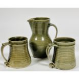 A St Ives Pottery baluster jug with two horizontal lines to top , (h 20cm), and a pair of matching