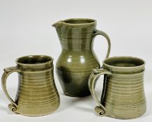 A St Ives Pottery baluster jug with two horizontal lines to top , (h 20cm), and a pair of matching