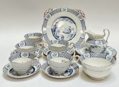 A part tea set of gilt blue and white Tuscan Bone China decorated with scenes of birds and trees
