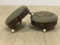 A pair of Victorian rosewood veneered pine circular footstools, with embroidered top over gilt metal