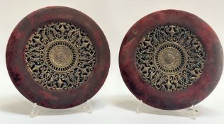 A pair of 19thc gilt metal circular panels each pierced and cast with floral and foliate motifs in