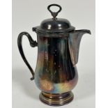 A large Epns water jug of baluster form with domed ring top cover and C scroll handle to side. (28cm