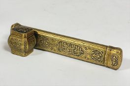 An Islamic Ottoman Qalamdan brass ink well and quill pen holder, with engraved scrolls and