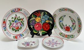 A mixed group of Hungarian ceramics comprising a pair of Hollohaza porcelain plates with enamelled