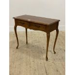 A cherry wood console table in the French taste, serpentine top over two frieze drawers, raised on
