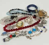 A collection of costume jewellery, including agate bead necklaces, bracelet, silver brooches,