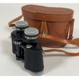 A pair of Prinz Prinzlux 8 x 30 field glasses complete with leather case and lens covers, show