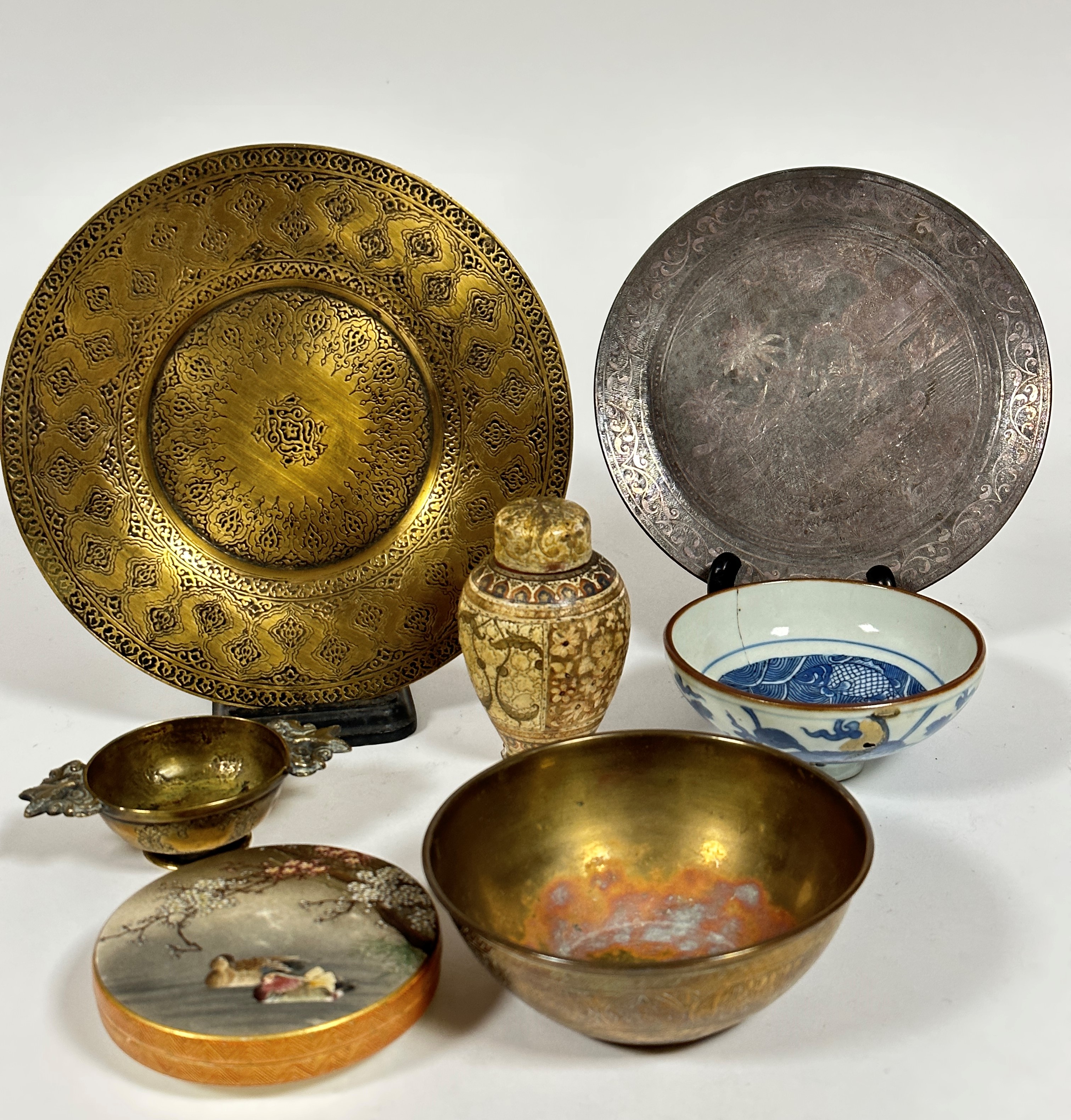 A collection of Eastern ceramics and metalware including a circular brass engraved dish (d .