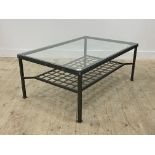 A contemporary glass and aluminium coffee table with magazine rack under H49cm, 79cm x 119cm