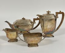 An Edinburgh 1930's silver four piece tea and coffee set of rectangular panelled form, with square