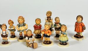 A collection of ten Hummel pottery figures including, Winter Song, For Keeps, Once Upon a Time,