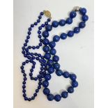 A lapis lazuli bead necklace with magnetic ball clasp fastening (21cm x 1cm) and a lapis lazuli bead