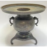 A Japanese bronze tripod censer with engraved and inlaid village scene with mountains and a lake,