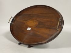 An Edwardian mahogany twin handled drinks tray, galleried sides enclosing boxwood conch inlay to