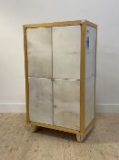 A contemporary birch and velum covered two door hi-fi cabinet, with two adjustable shelves to