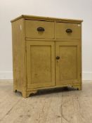 A Victorian painted pine side cabinet, fitted with two drawers over twin panelled cupboard doors
