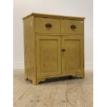 A Victorian painted pine side cabinet, fitted with two drawers over twin panelled cupboard doors
