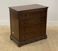 A carved oak chest of drawers of 18th century design, fitted with four drawers, raised on a shaped