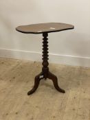 A Victorian mahogany snap top table, the serpentine top raised on bobbin turned column and tripod