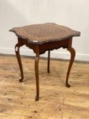 An early 20th century mahogany occasional table, the top with ebonised moulded edge of serpentine
