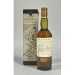 A bottle of Talisker 1990's 10 year old single malt whiskey, with a map label of the distillery in