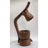 An unusual table lamp formed from and African carved wooden mortars. H75cm