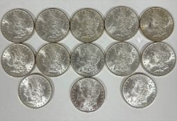 A collection of thirteen American 1885 Morgan O $1 silver coins in uncirculated condition. (13)