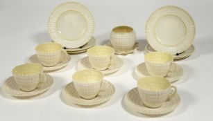 A Belleek Irish porcelain twisted shell tea service comprising six saucers, six tea cups, a sugar