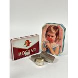 A vintage Cremona octagonal toffee tin (4cm x 20cm) and a Dutch Hofnar cigarette box (2cm x 18cm),