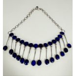An Afghanistan white metal chain necklace set fourteen lapis lazuli oval hinged stones with