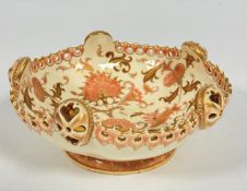 A Hungarian Zsolnay Pecs pottery circular dish with scalloped border with five oval raised pieced