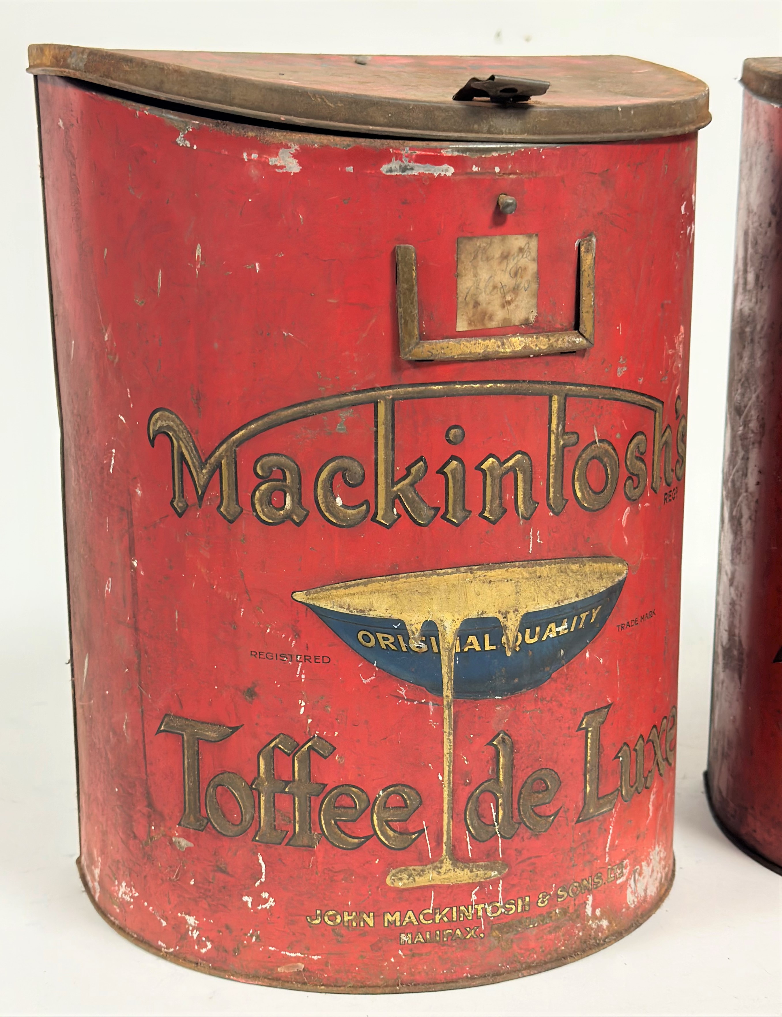 A pair of large display Mackintosh's Toffee De Luxe red tins with clip lids decorated with relief - Image 2 of 4