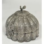 An Indian white metal circular fluted domed top casket with peacock knop to top and all over